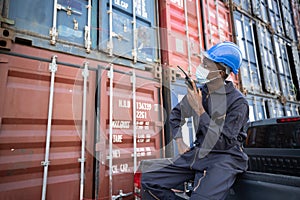 Black Inspector with Inspecting the Containers at the Port