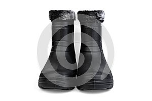 Black insulated boots for hunting, fishing and traveling in winter isolated on white background.