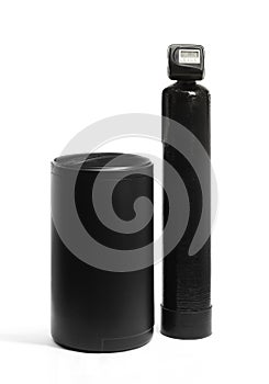 A black, ion exchange water softener with brine tank.