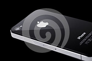 Black iPhone 4s on black background