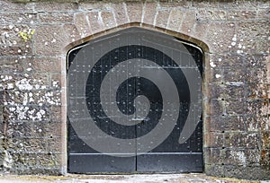 Black iron door in castle.