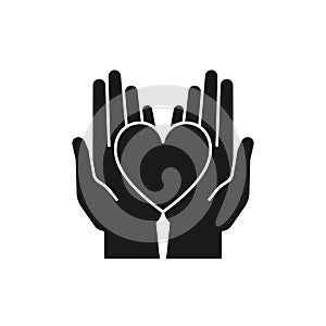 Black isolated icon of heart in 2 open hands on white background. Silhouette of heart and two hands. Symbol of care, love, charity