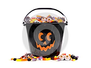 Black Jack o Lantern candy collector with candy pile over white photo