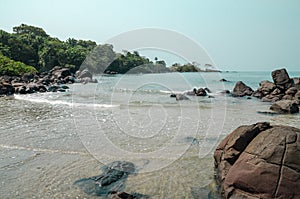 Black Johnson Beach in Sierra Leone, Africa with calm sea, ropcks, and deserted beach