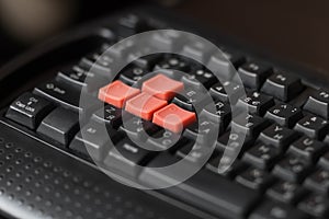 Black keyboard with bright game keys. Close up