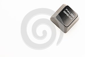 Black keyboard button with a white inscription Pause Break in the corner on a white background