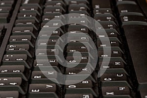 Black keyboard closeup. Keyboard pattern. Horizontal pattern. Vertical pattern.