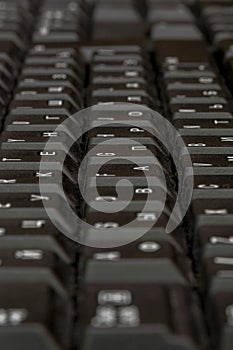 Black keyboard closeup. Keyboard pattern. Horizontal pattern. Vertical pattern.