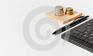 Black keyboard, pen and euro currency on white background. Business idea and development concept.