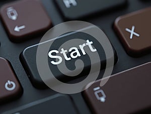 Black keyboard with start button suggesting beginning of new project