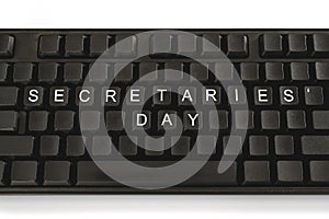 Black keyboard on white background. The inscription on the buttons - Secretaries Day. Minimal concept photo