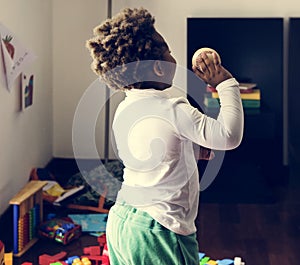 Black kid throwing baseball ball