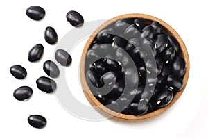 black kidney beans in wooden bowl isolated on white background. top view