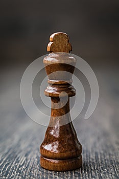 Black King, Chess Piece on a Wooden Table