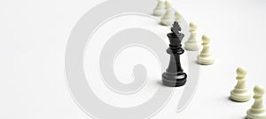 Black king chess standout from white pawn chess for sign of leadership and management boss concept