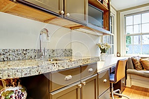 Black kitchen cabinets with marble counter top