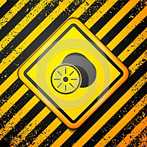 Black Kiwi fruit icon isolated on yellow background. Warning sign. Vector