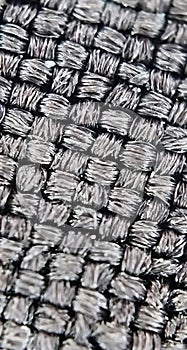 Black knitted fabric in a microscope