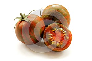 Black kumato tomatoes isolated