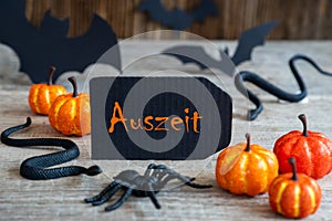 Black Label, Text Auszeit Means Downtime, Scary Halloween Decoration photo