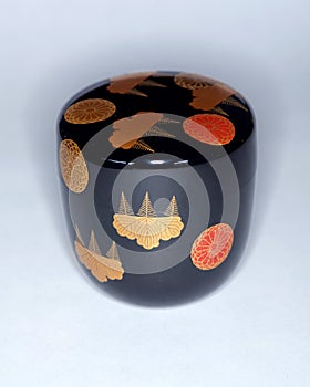 Black lacquer tea caddie made for the Japanese tea ceremony with auspicious designs