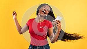 Black Lady Listening Music On Smartphone Wearing Earphones, Yellow Background