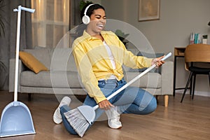 Black Lady Sweeping Floor Having Fun Pretending Playing Guitar Indoor