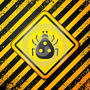 Black Ladybug icon isolated on yellow background. Warning sign. Vector