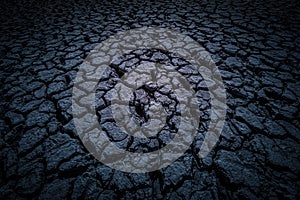 Black land, humus, covered with deep cracks in the dark as background or backdrop