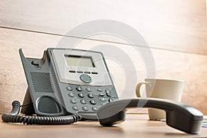 Black landline telephone with handset off line