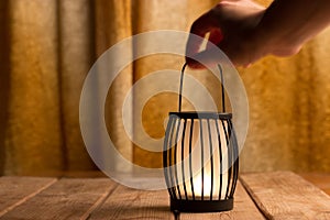 Black lantern with a candle