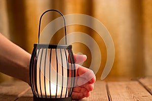 Black lantern with a candle