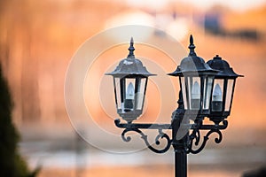 Black lantern lamp post with blurry background