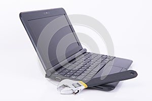 Black laptop with a wrench