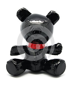 Black latex toy bear isolated on white background photo