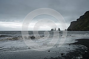 The black lava beach in the city of Vik overlooking the sea