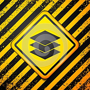 Black Layers clothing textile icon isolated on yellow background. Element of fabric features. Warning sign. Vector