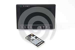 Black lcd tv with remote on the white background