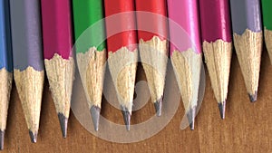 Black lead pencils lie in a row