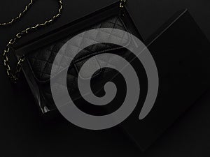 Black leather bag with golden chain