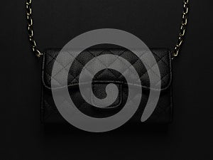 Black leather bag with golden chain