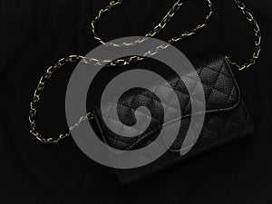 Black leather bag with golden chain