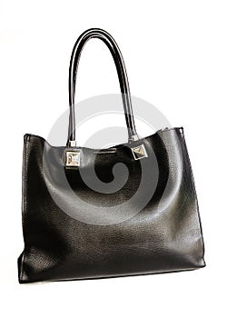 Black leather female bag isolated on white background. Glossy stylish fashion women bag. Women`s bags and accessories