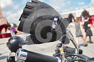 Black leather glove on handlebars