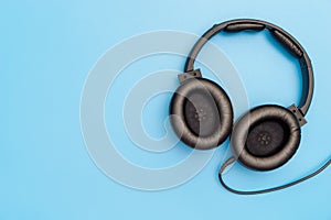 Black Leather Headphone on blue for Music Concept
