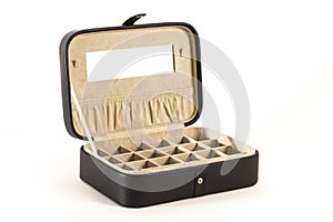 Black leather jewellery box with open lid.