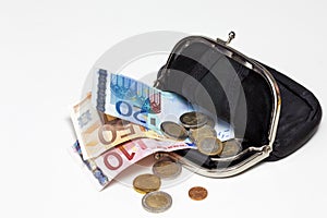 Black leather purse with euro notes and coins on white background