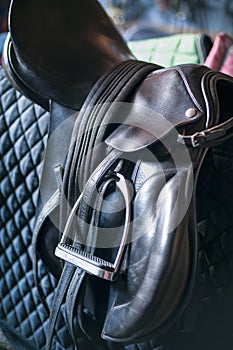 Black leather saddle and equestrian sport equipment and accessories