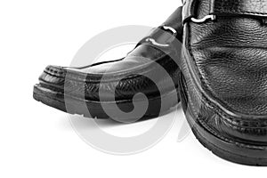 Black leather shoes isolated on white background