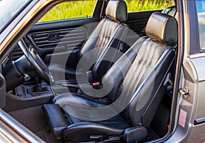 Black leather sport seats of retro car
